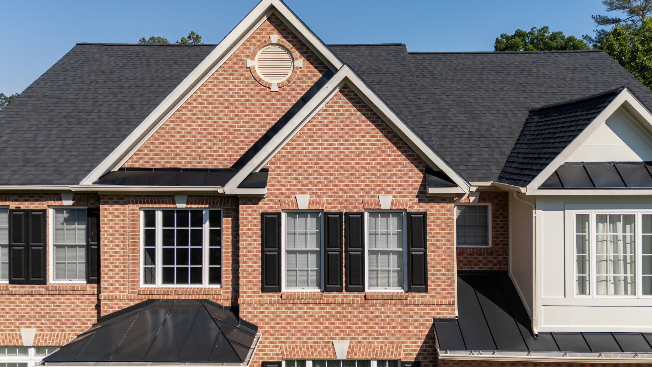 New seamless gutters installed along the roofline of a Northern Virginia home